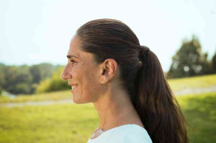 Young woman with a ponytail in the countryside
