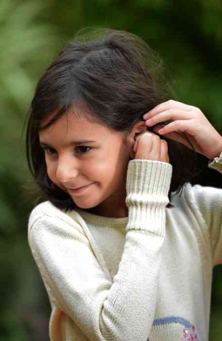 Little girl wearing Hearing Aids for Kids