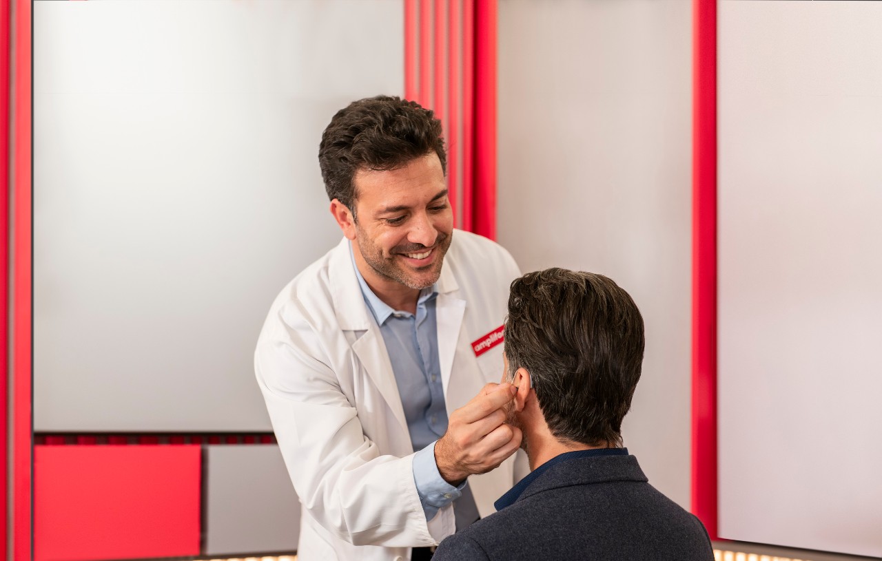A senior couple celebrating birthday with a cake