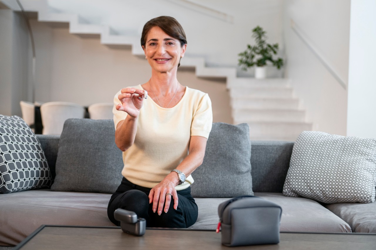 woman with heating aids at home