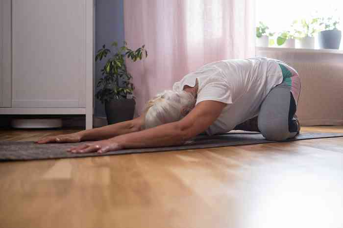 Old woman doing yoga