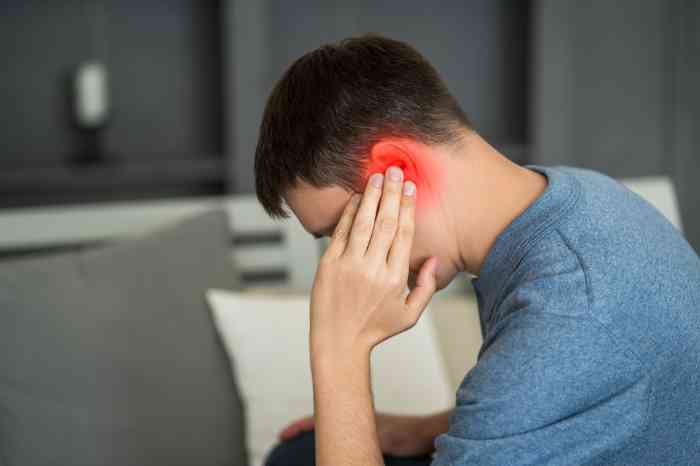 Young man with red ear