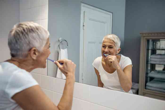 Woman brushing teeth