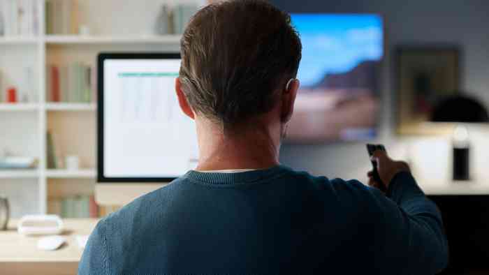 a man sitting on sofa