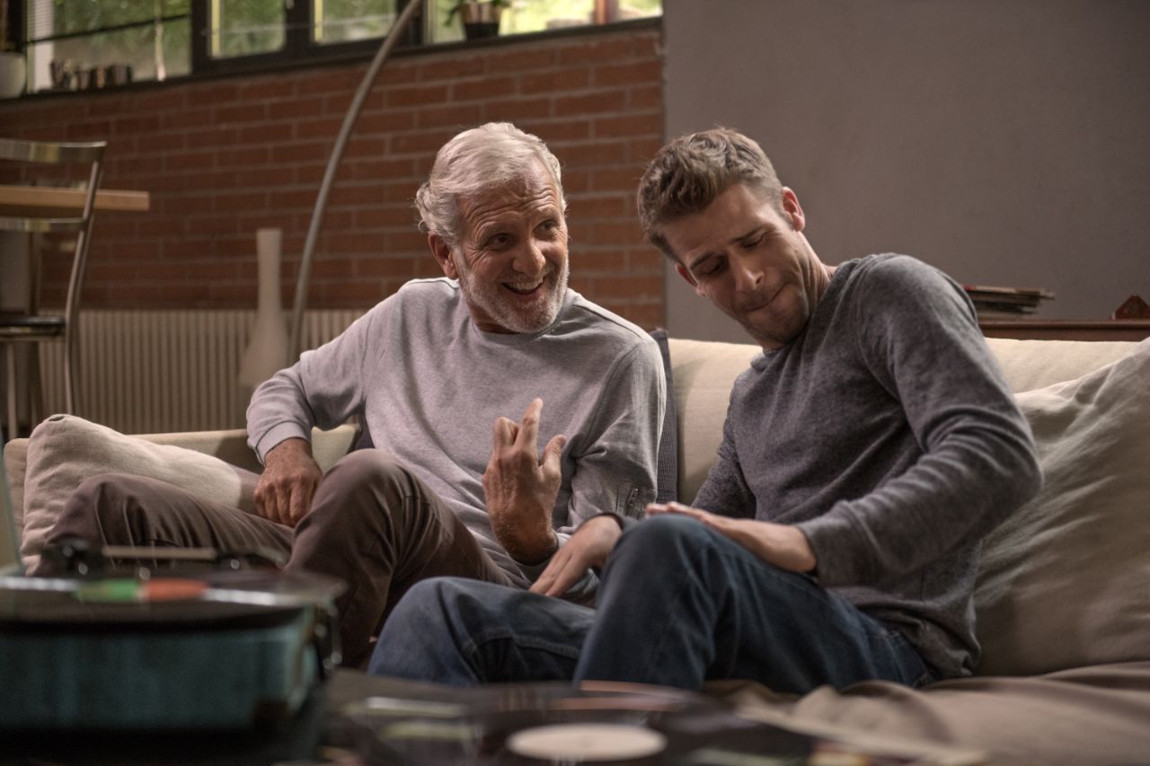 grandpa and nephew using a turntable together.