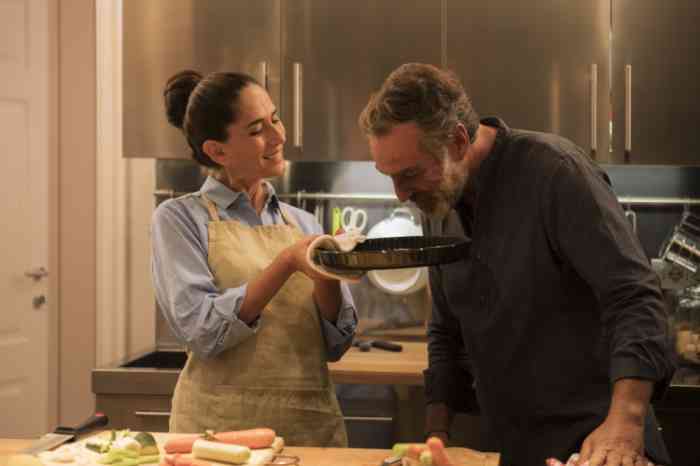 Couple cooking a cake together in the kitchen