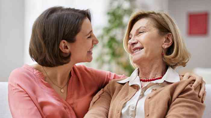 two women talking and smiling