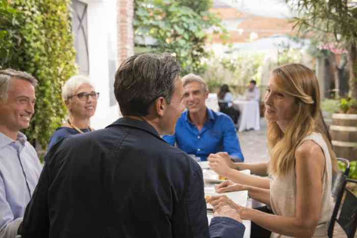 A family moment around a table talking and listening to each other