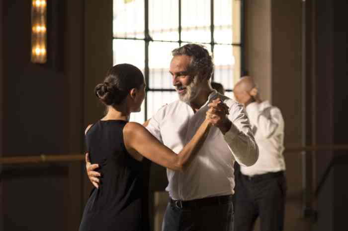 A couple wearing hearing aids is dancing tango