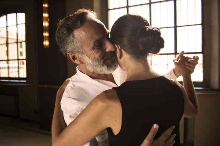A couple dancing tango together, the woman wearing Hearing Aids