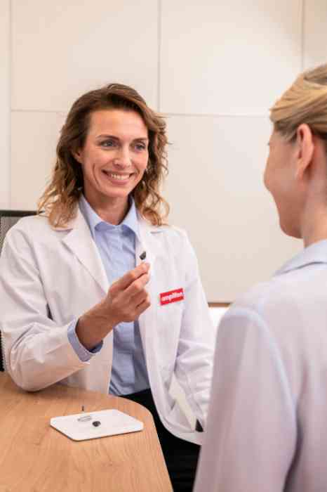 audiologist with hearing aid