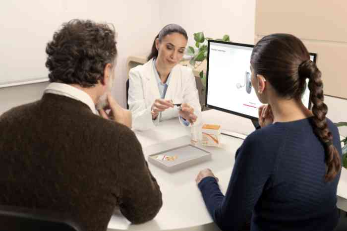 Couple in the bedroom with woman with Behind-The-Ear Hearing Aid