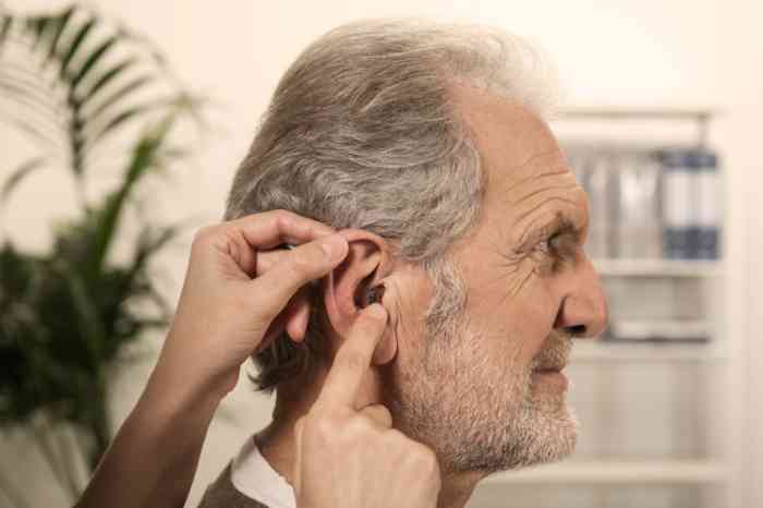 Profile of a woman wearing Behind-The-Ear hearing aids