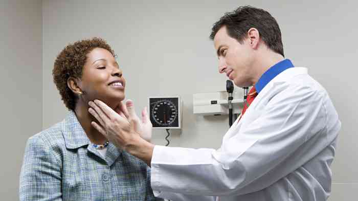 audiologist examining a woman.