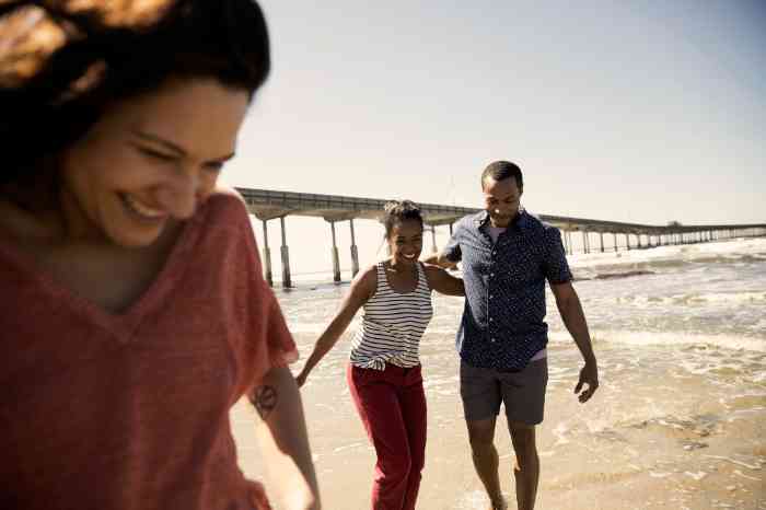 Four young girls walking, laughing and enjoying their time together