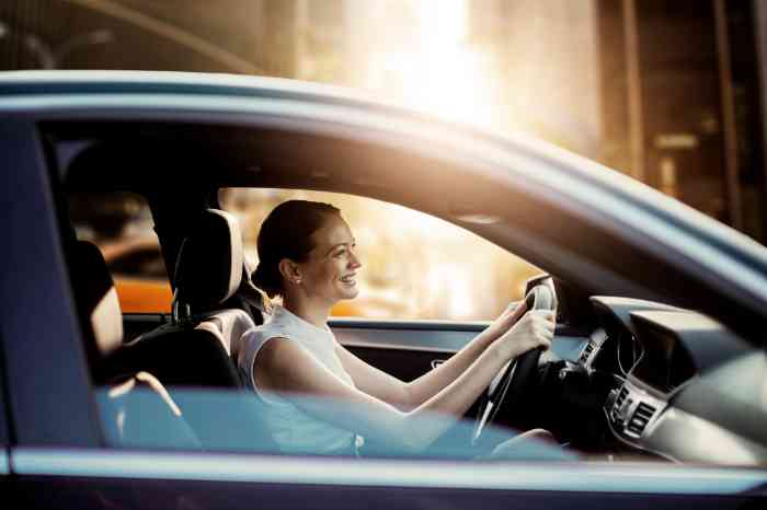 A young girl driving her car