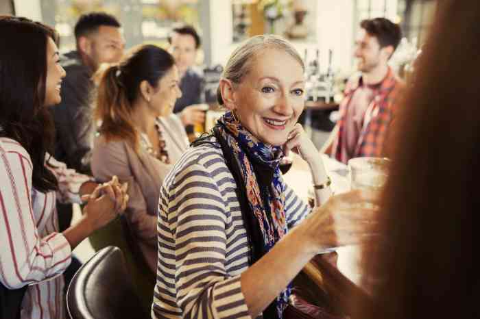 A woman wearing a hearing aid in a café
