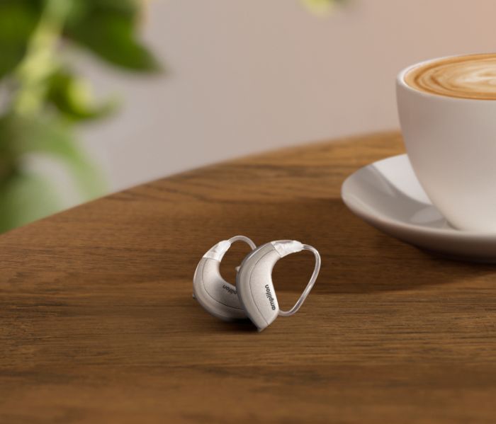 Couple watching TV with hearing aids